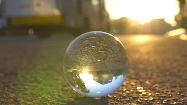 glass ball in the city at sunset