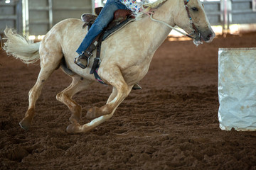 Horse And Rider Barrel Racing At A Rodeo