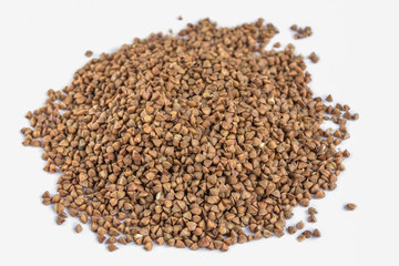 Pile of buckwheat isolated on white background.