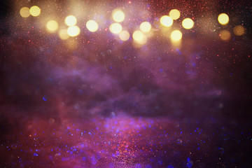 Obraz na płótnie Canvas Purple, red, pink, gold and black glitter lights background. defocused.