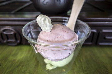 Transparent glass with strawberry ice cream