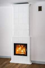 bright tiled stove with fire