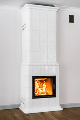 Bright tiled stove with fire