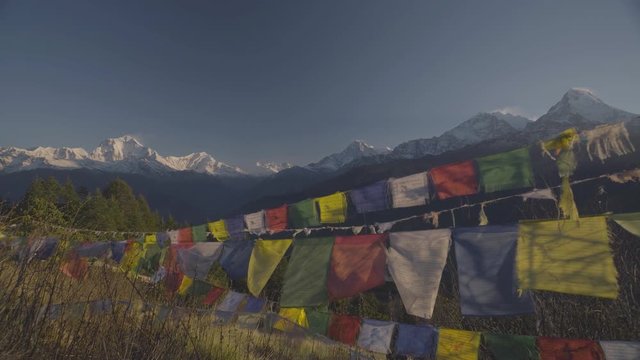 Colorful Himalaya Prayer Flags blowing with Mountain view from Poon Hill, Nepal in April