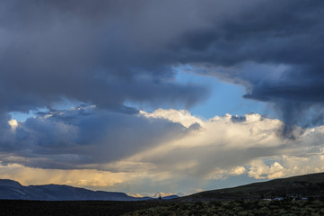 Threatening storm clouds are hanging low over mono lake, near the town of Lee Vining, in the Sierra Nevada mountain range. Sierra Nevadas, Eastern California, USA.