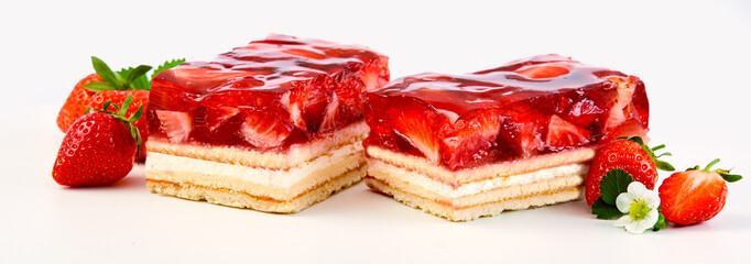 Two slices of strawberry and cream layer cake