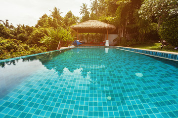 Veranda private swimming pool near luxury villa. Sunny summer vacation