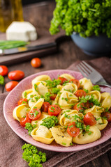Filled tortellini with herbs, tomatoes