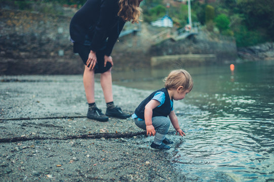 Mother with toddler by the water