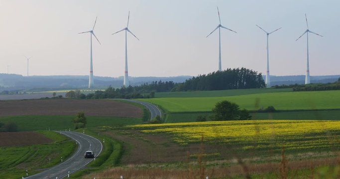 renewable energy: power generating wind turbines in the countryside