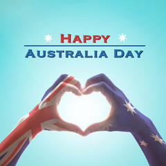 Happy Australia day with national flag on hands in heart shape