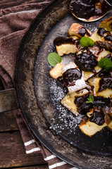 Cutted pancakes, Kaiserschmarrn delish dessert with plums