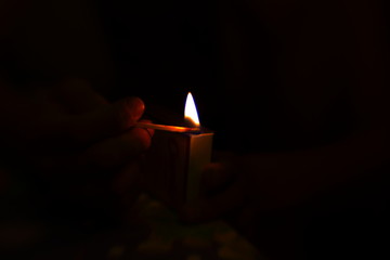lighting a candle in the dark