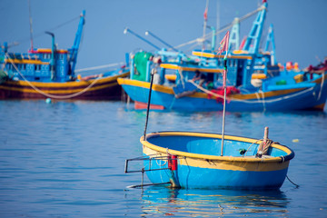 Fototapeta na wymiar Vietnam,Muine, fishing village, 27 may 2018-boats with fisherman in the sea