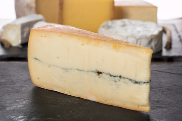 french Morbier cheese on a slate plate