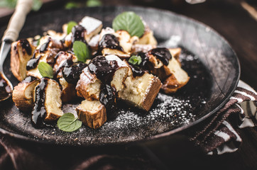 Cutted pancakes, Kaiserschmarrn delish dessert with plums