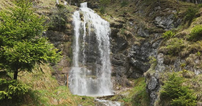 falling waterfall (Buchauer Wasserfall) - waterfall situated by the Achen lake (Achensee), Tyrol, Austria