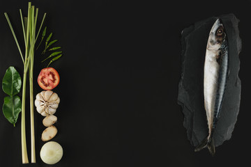 Fresh mackerel,fish and ingredient on stone  ,black background