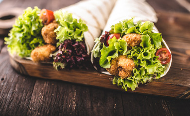 Grilled tortilla with chicken, mayo and tomato ketchu....Grilled tortilla chicken, lettuce, homemade mayo and barbeque sauce