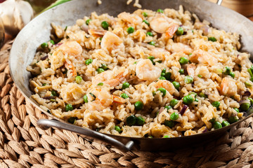 Fried rice with shrimp and vegetables on a frying pan