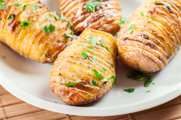 Baked potatoes with cheese and herbs