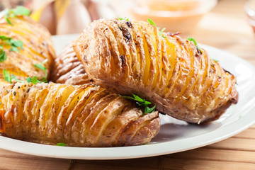 Baked potatoes with cheese and herbs