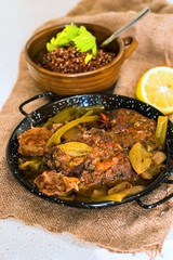 Pork meat in spicy sauce and quinoa.