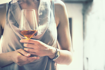 loving girl holding wine glass, woman with elegant dress drinking a typical italian beverage