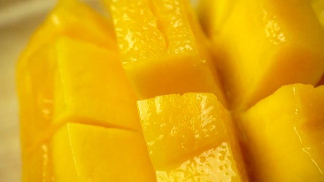 Rotate of mango slice. Closeup 4K Resolution.
