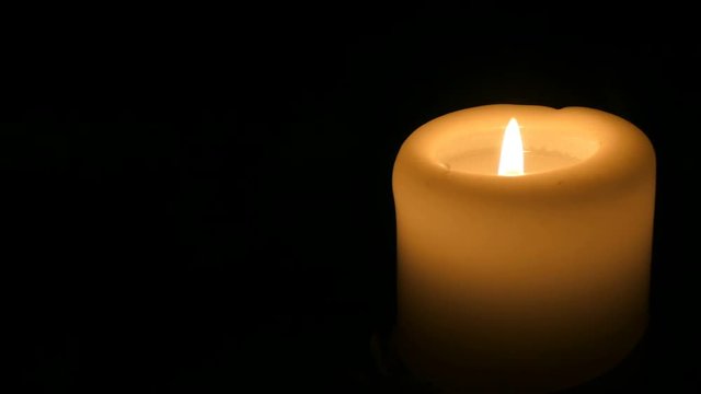 Candle in the dark lit