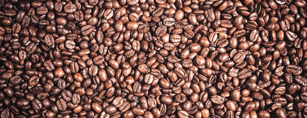 Background of  roasted coffee grains macro close-up