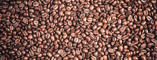 Background of  roasted coffee grains macro close-up