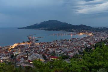 Aerial night view of Zakynthos (Zante) town. Beautiful cityscape panorama of Greece city. Traveling concept background.