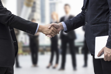 Successful negotiating business concept, Businessmen shaking hands after finishing meeting or...