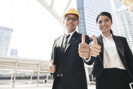 Compliment of teamwork, businesspeople show thumb to praise and great sign for parthner