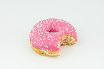 Delicious Bitten Pink Donut With White Chocolate Sprinkles Isolated On White