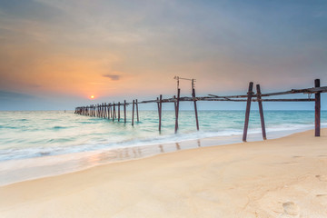 Obraz na płótnie Canvas Wooden bridge on the beach at sunset,Phuket,Thailand.