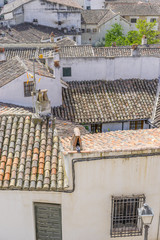 Ancient tile roofs of Chinchon, Madrid, Spain. View from upper side of the main square in the historic small town Chinchon, near Madrid
