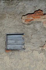 Old shutter window brick wall