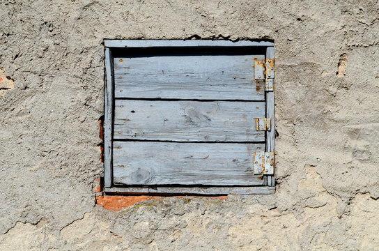 Old wooden window shutters of an old house, vintage background.