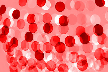 Ultra red background. Abstract blurred background with rows of round, radiant lights.