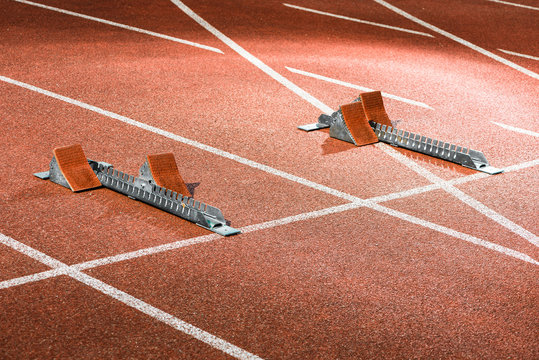 Starrting blocks at cinder track of athletics stadium
