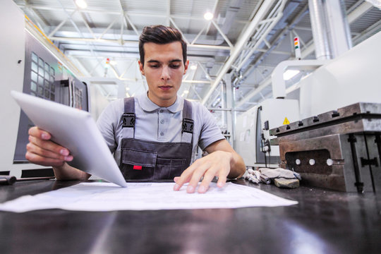 Man working with documents at plant