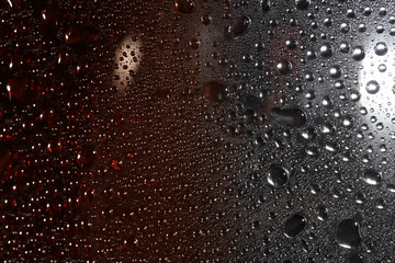 liquid droplets on a transparent surface