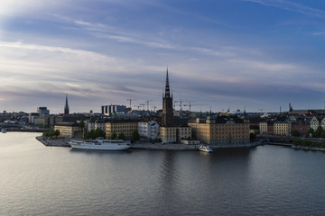 Fototapeta na wymiar Old town island/Late evening view of Gamla Stan Stockholm old town island dominated by the church belfry.