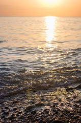 Obraz premium Amazing sea sunset, the sun, waves, clouds