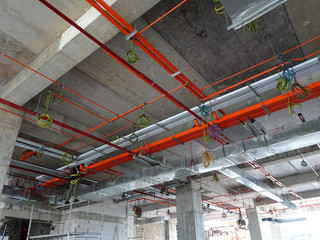 Electrical conduit, cable tray and aircond pipes as part of services above ceiling installed at the construction. 