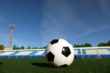 Fototapeta na wymiar Football on a green field