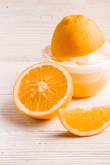 oranges and juice on a white background
