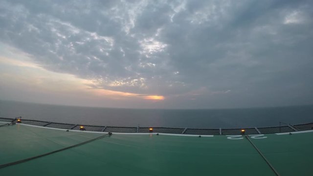 Clouds time lapse, sunset view, on offshore Helicopter platform. 4k Time-lapse photography 